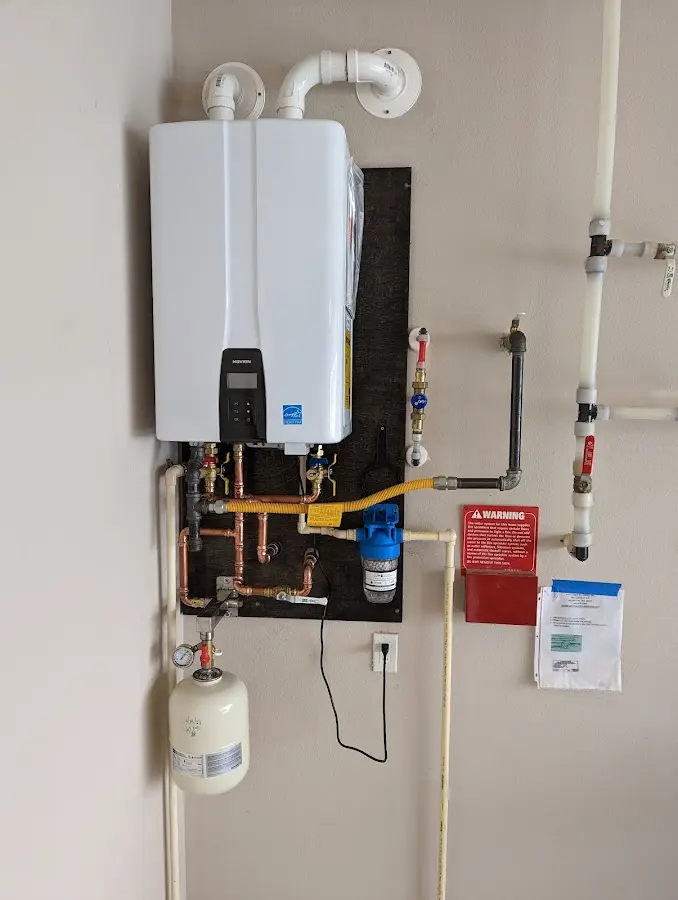 Professional plumber installing copper piping in a Pine Bluff home